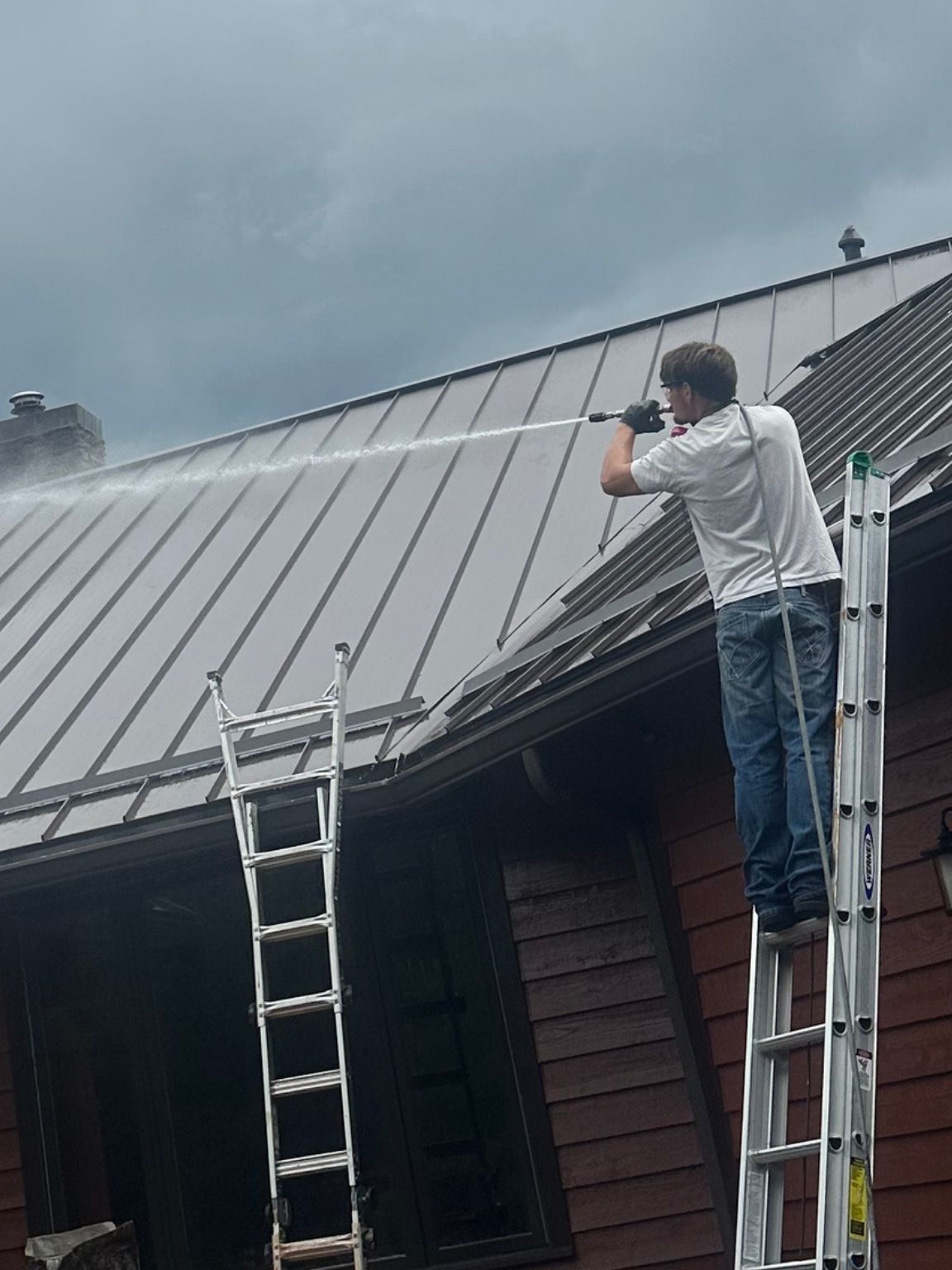 Professional roof cleaning in progress